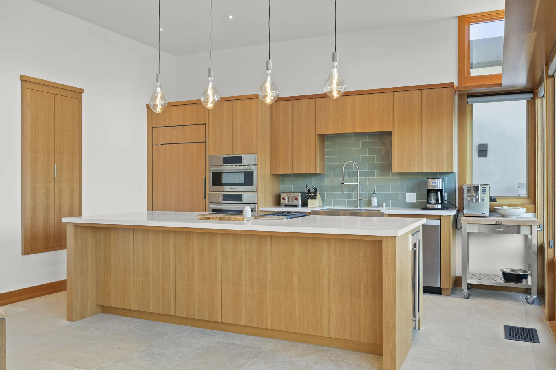Kitchen with warm wood cabinetry and a large island