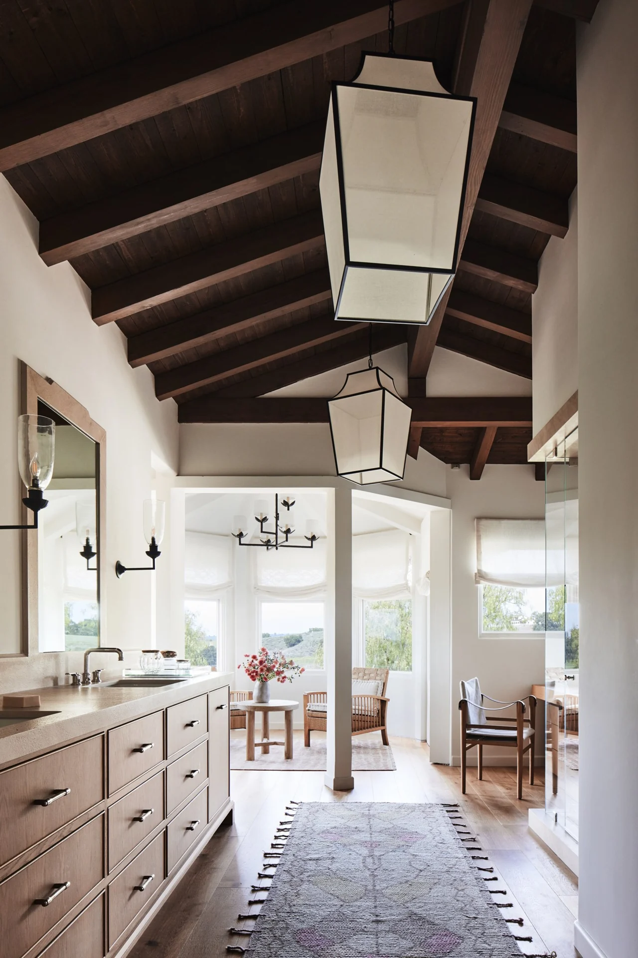 Bathroom with timber ceiling and a sunlit sitting area