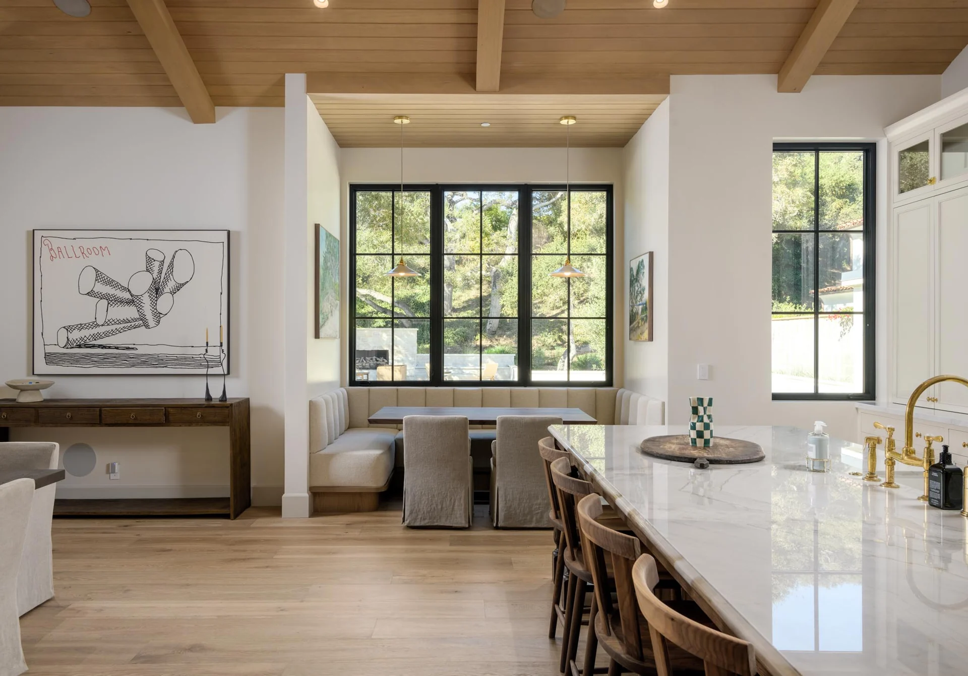 Kitchen island and window-lined breakfast nook