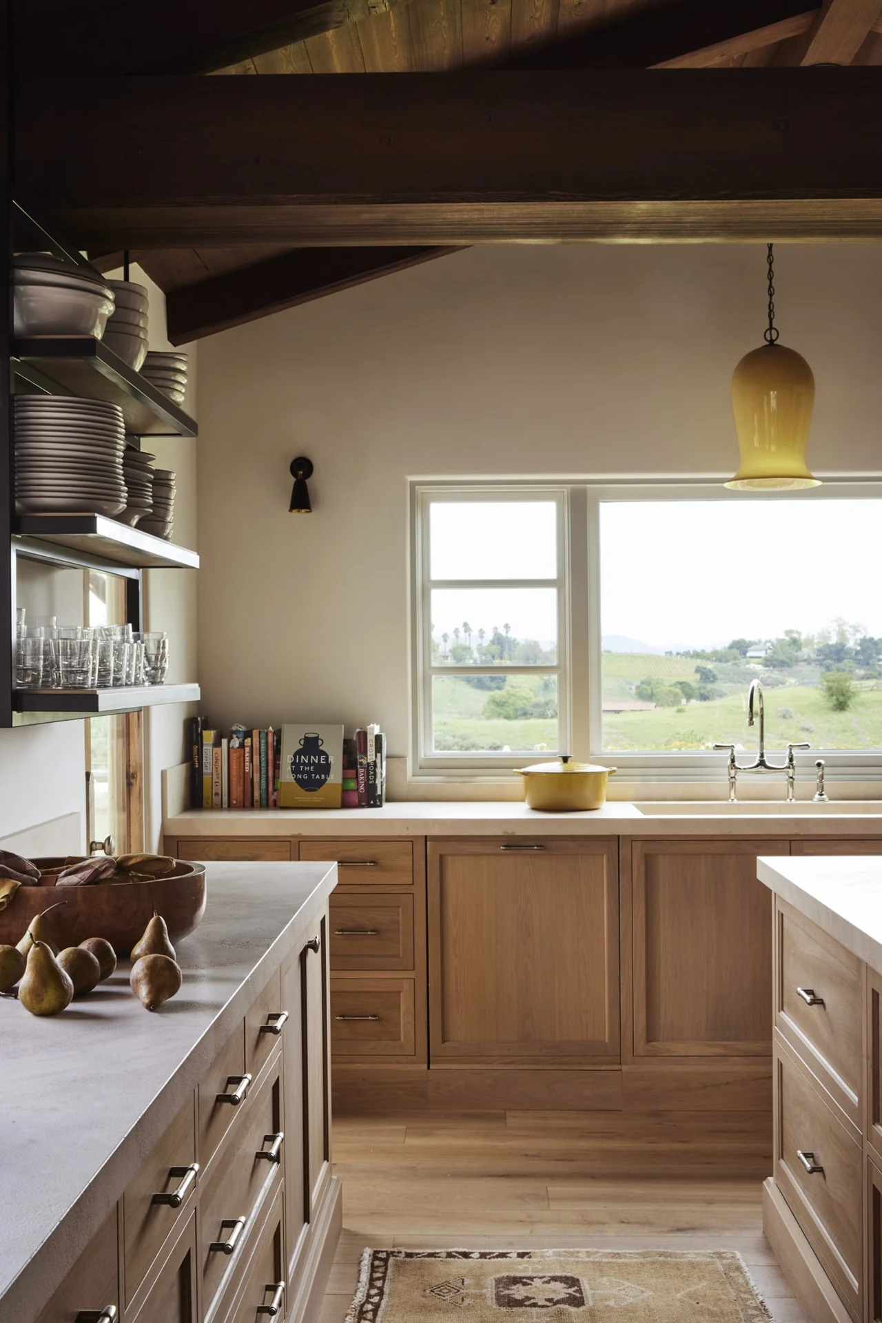 Kitchen with wood cabinetry and views over the estate