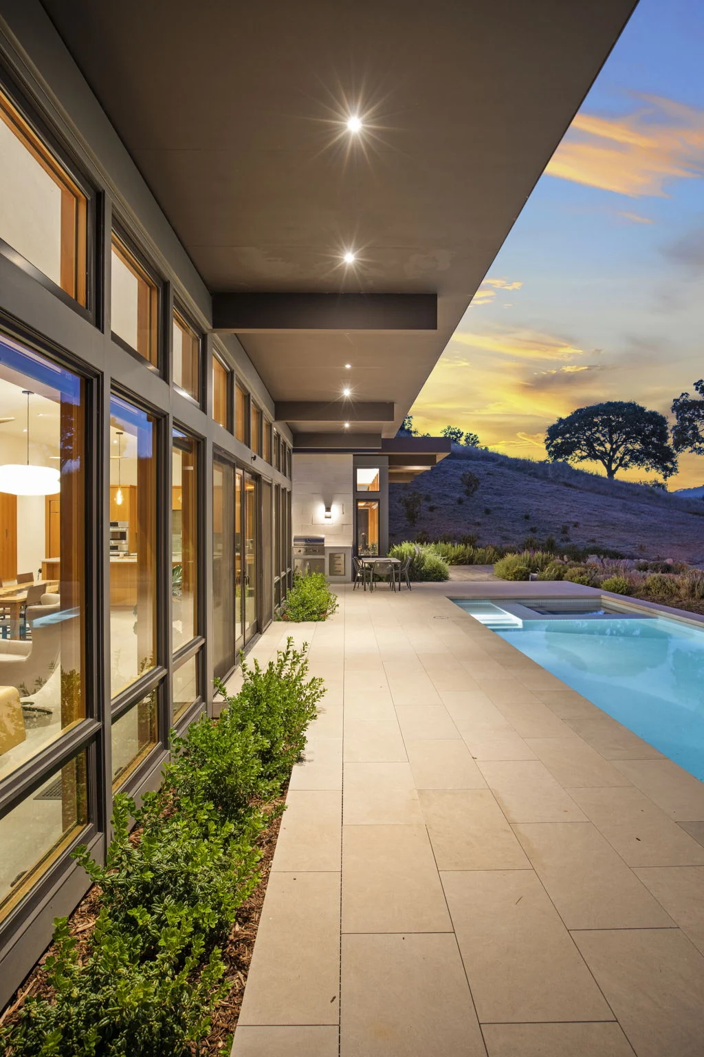 Covered pool terrace at sunset