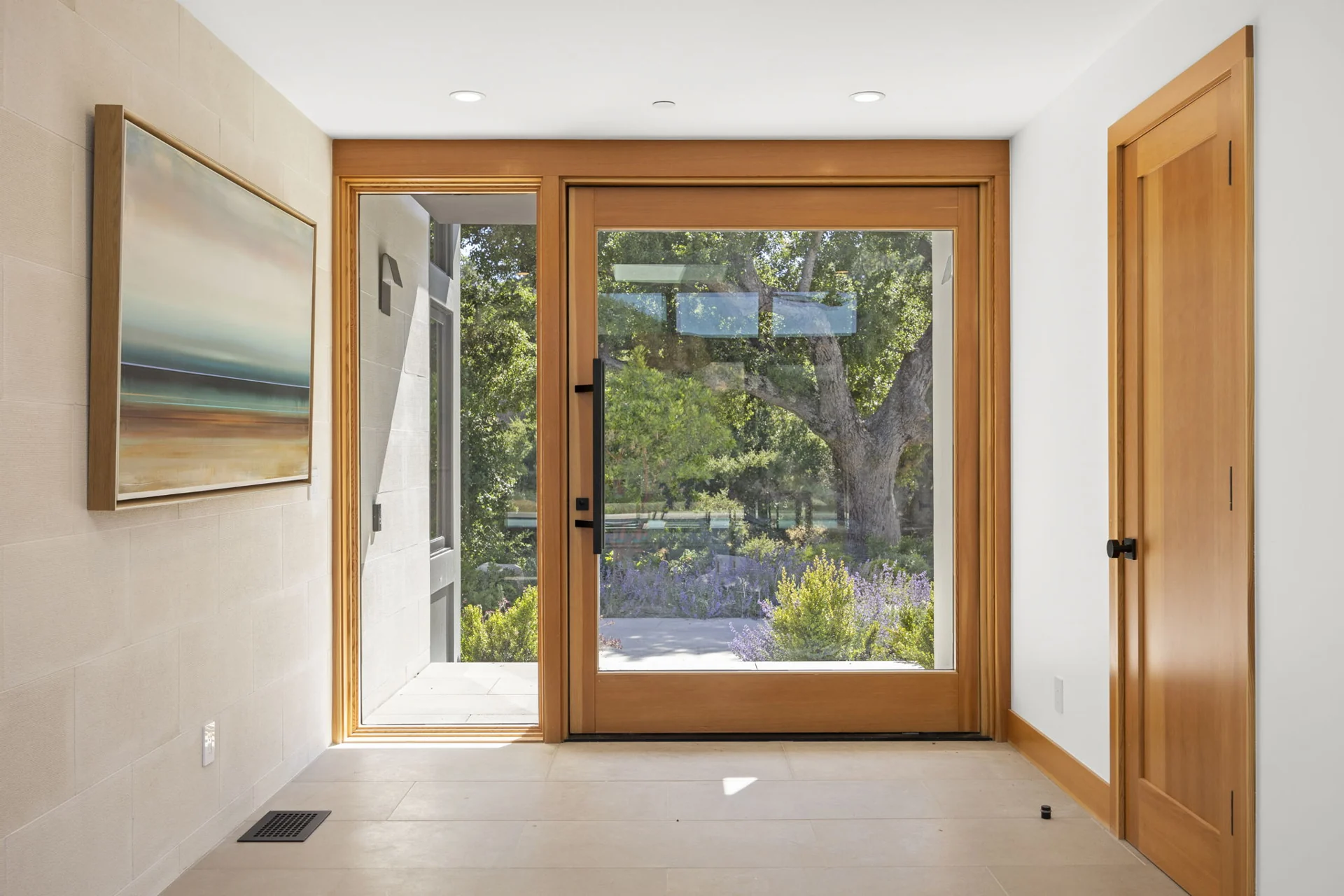 Wood-framed glazed entrance overlooking the garden
